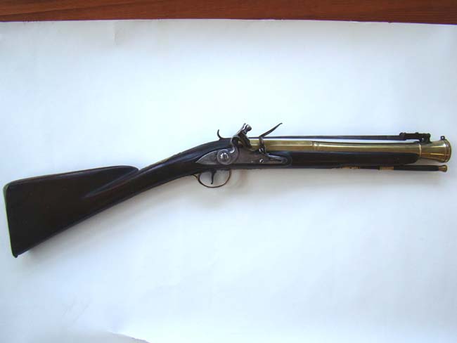 An English Revolutionary War period blunderbuss with spring mounted bayonet by Joseph Heylin of London circa 1775-1780.